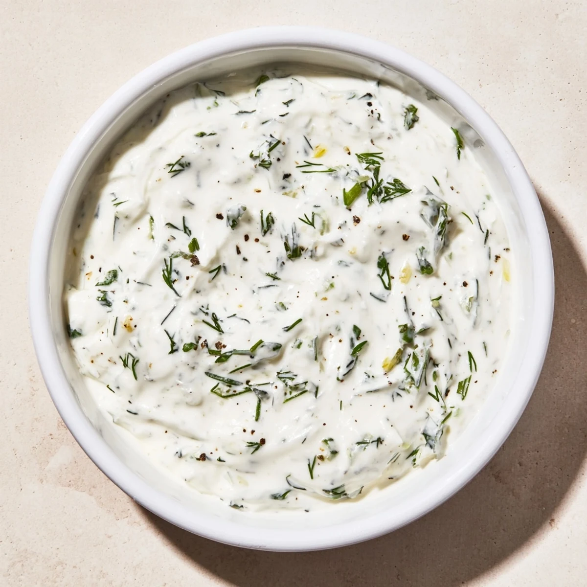 A bowl of Greek Yogurt Ranch Dip, creamy and herb-filled, ready to dip fresh vegetables into.