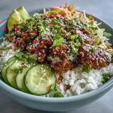 Bang Bang Ground Turkey Rice Bowls featuring juicy ground turkey in spicy bang bang sauce, layered with rice, shredded carrots, cucumber, cabbage, and sesame garnish.