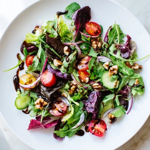 Fresh, vibrant Quick Balsamic Vinegar Salad; a delicious blend of greens, tomatoes, and tangy balsamic dressing.