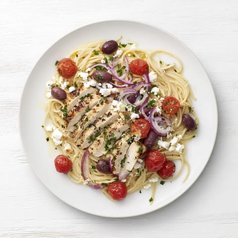 Grilled chicken, cherry tomatoes, and briny Kalamata olives tossed with spaghetti in a vibrant Greek Chicken Spaghetti.  