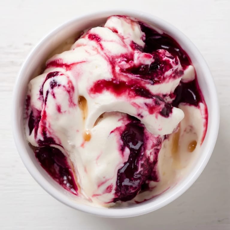 Scoops of rich, homemade cottage cheese ice cream, ready to serve in a bowl after chilling.